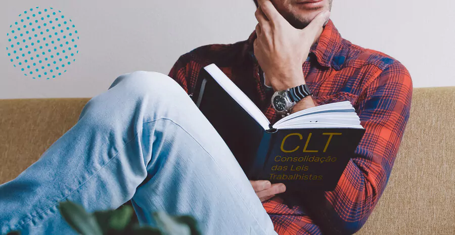 imagem de um homem sentado lendo o livro da clt