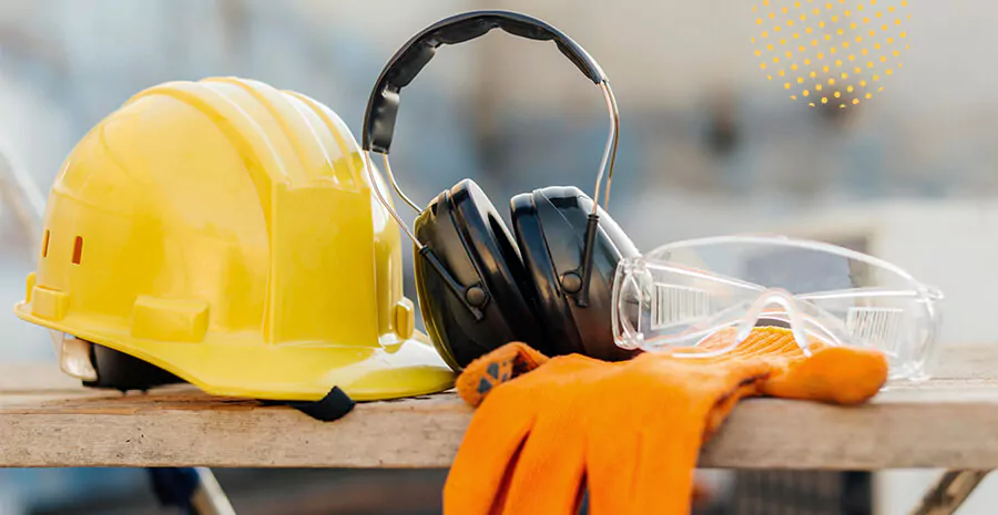 imagem de um equipamento de proteção com capacete, fone de ouvido e luvas