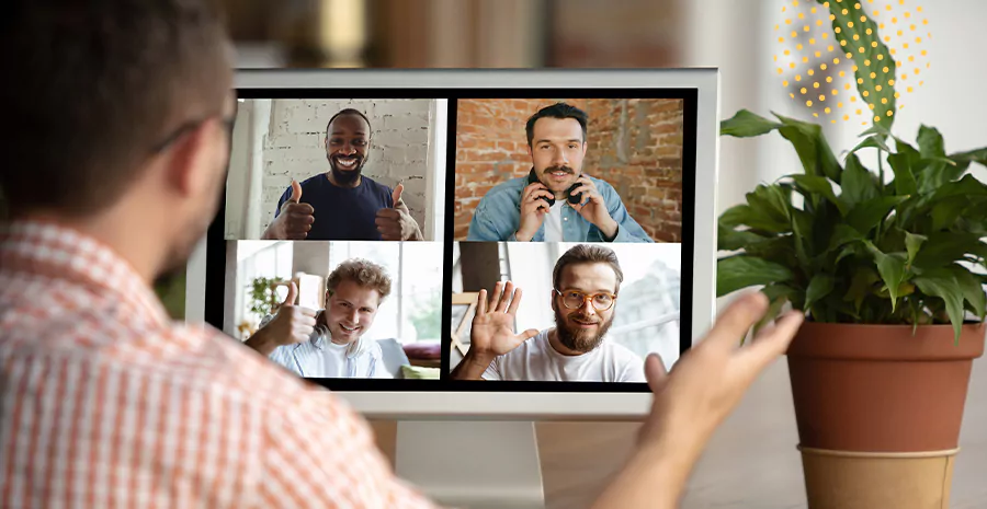 imagem de um homem fazendo chamada de vídeo com quatro pessoas pelo computador