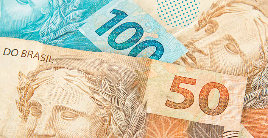 Cédulas de 100 e 50 reais, representando o real digital