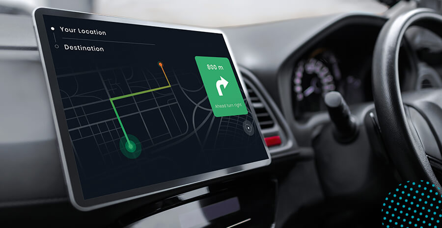 imagem de uma tela de rastreamento de local dentro de um carro, ao lado do volante
