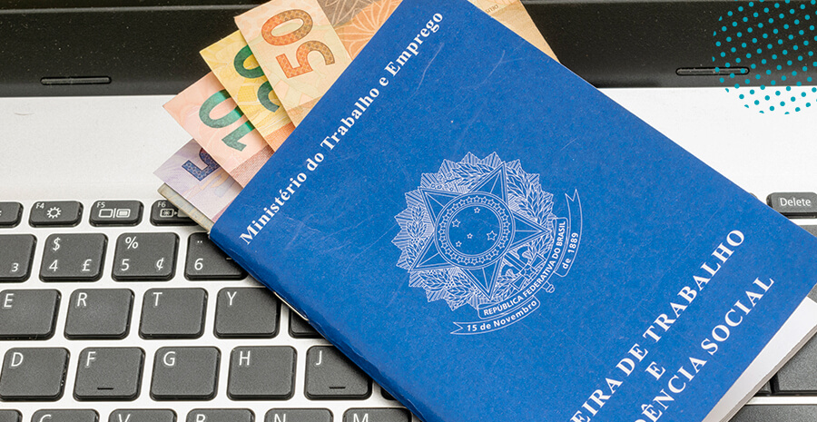 imagem de uma CTPS com notas de reais dentro