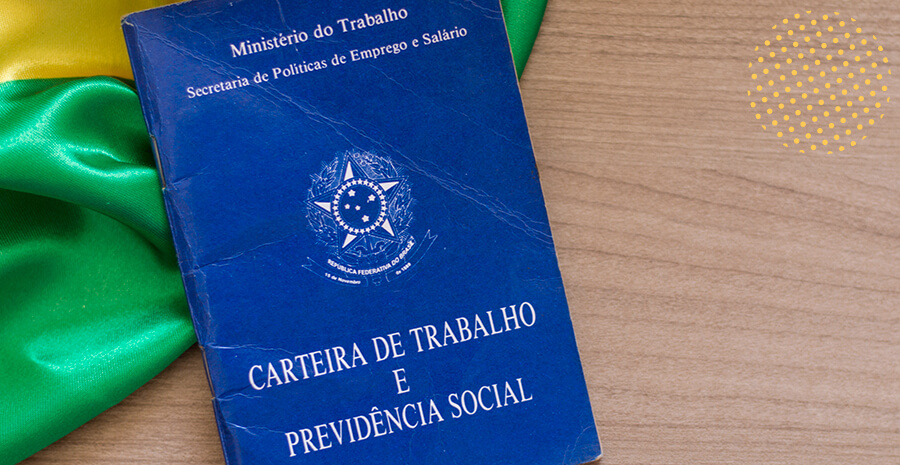 imagem da bandeira do Brasil e, em cima dela, uma carteira de trabalho