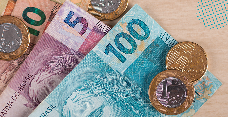 imagem de moedas de um real e de notas de cem, cinco e cinquenta reais